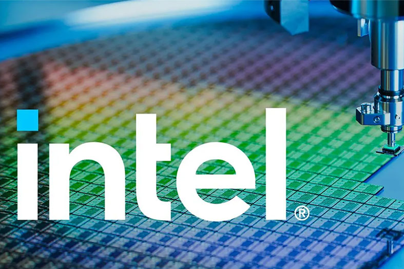 The image shows the Intel logo overlaid on a colorful silicon wafer with a robotic arm working on it, symbolizing semiconductor manufacturing and technology.