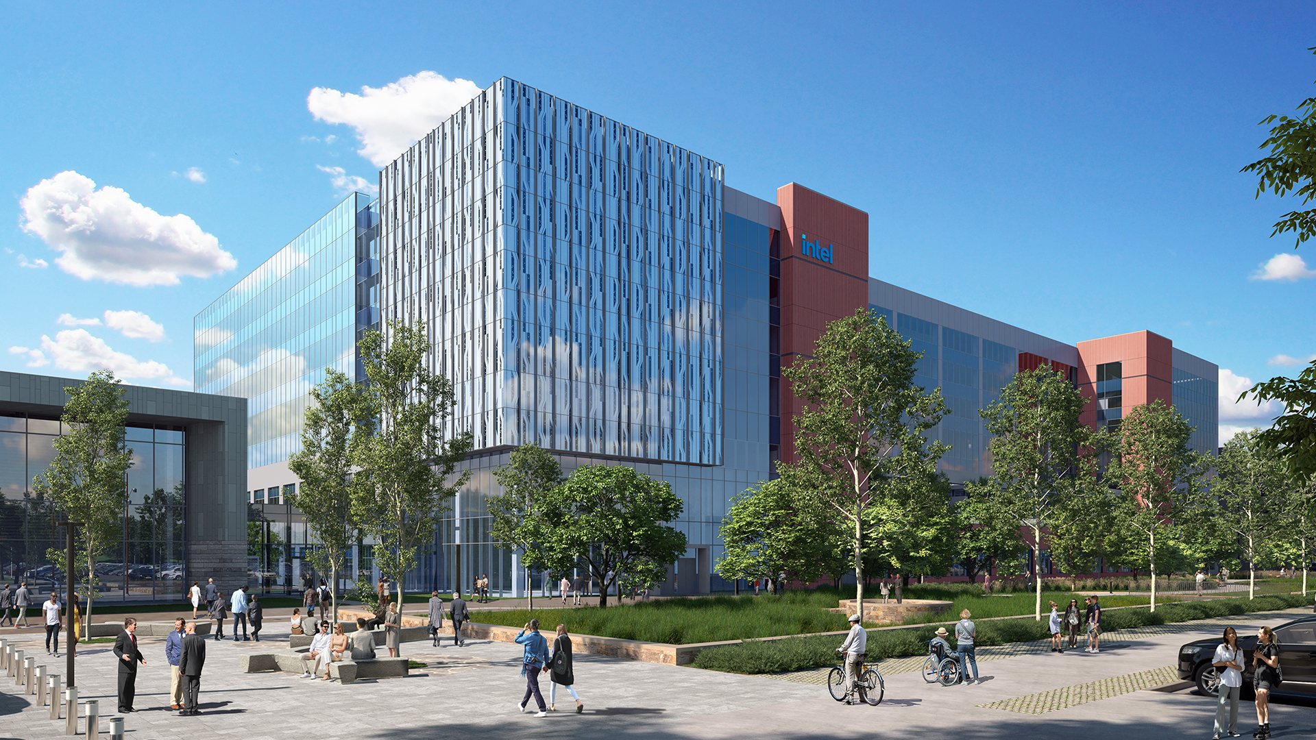 A modern office building with glass and red accents under a clear blue sky. People are walking and cycling in a spacious outdoor area with trees and greenery. The building has a corporate logo on its facade.