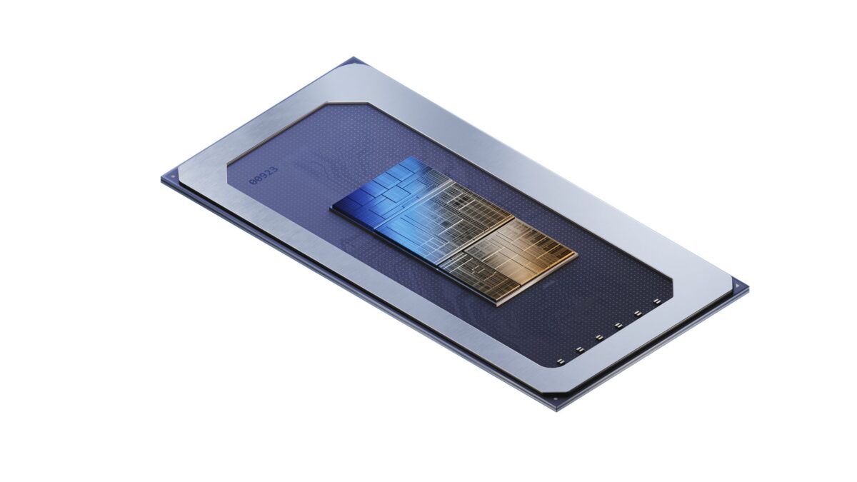 A rectangular microchip with a blue and metallic design is positioned diagonally against a white background. It features complex circuits and patterns, highlighted by contrasting blue and copper tones.