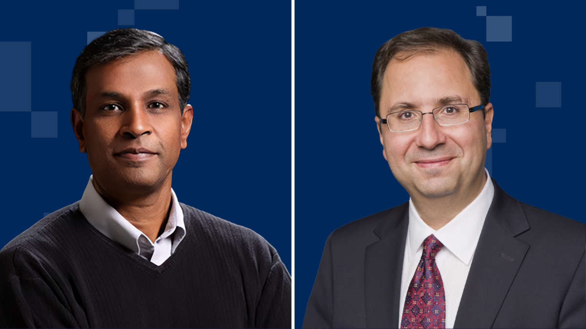 Two men are shown in separate frames against a dark blue background. The man on the left is wearing a dark sweater over a white shirt. The man on the right is wearing a dark suit with a white shirt and a patterned red tie.