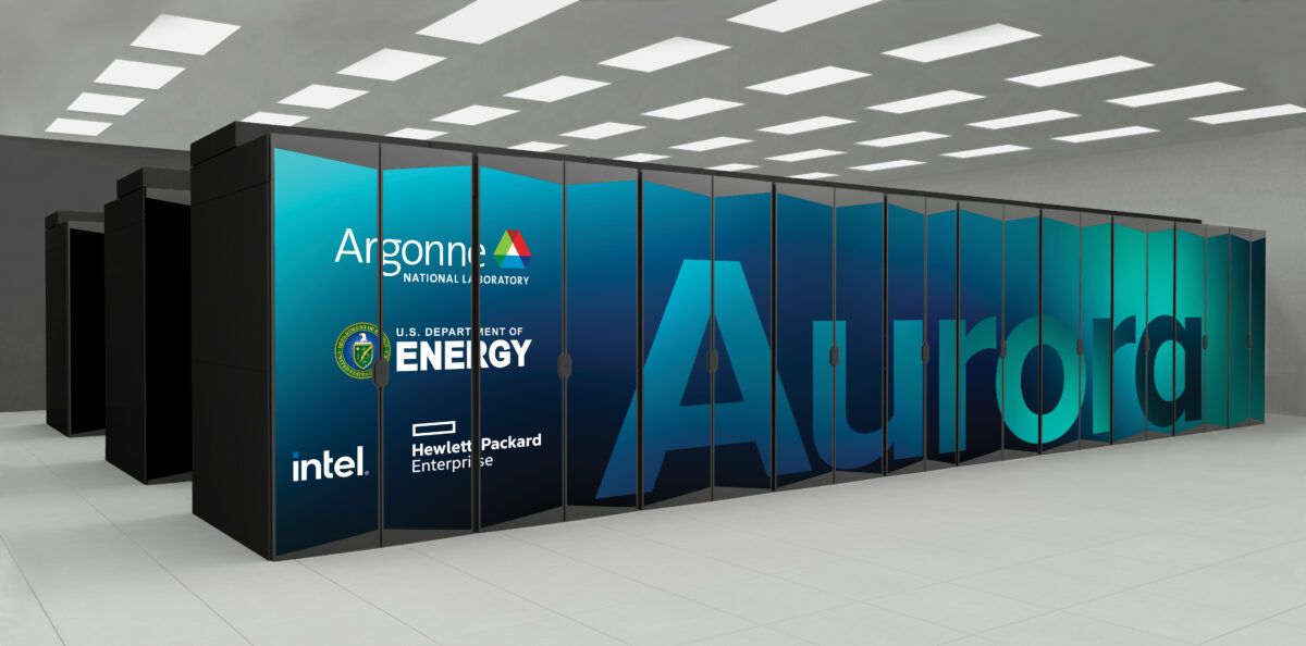 A large computer server with the word Aurora displayed on its side. Logos of Argonne National Laboratory, the U.S. Department of Energy, Intel, and Hewlett Packard Enterprise are visible. The room is well-lit with a tiled floor.