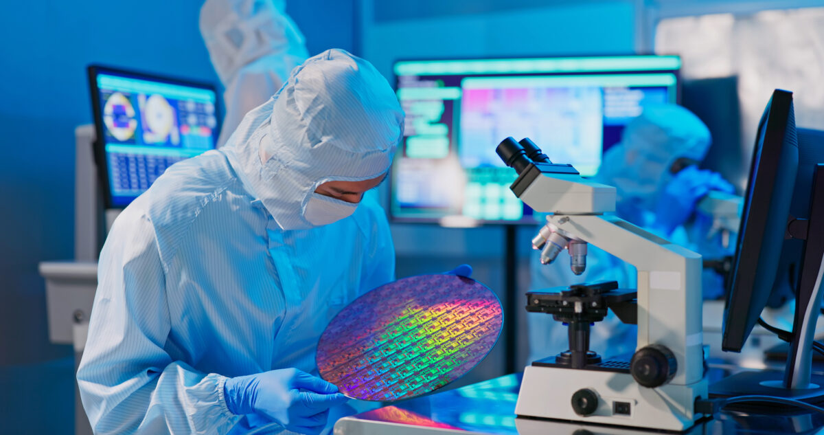 A technician with wafer doing testing