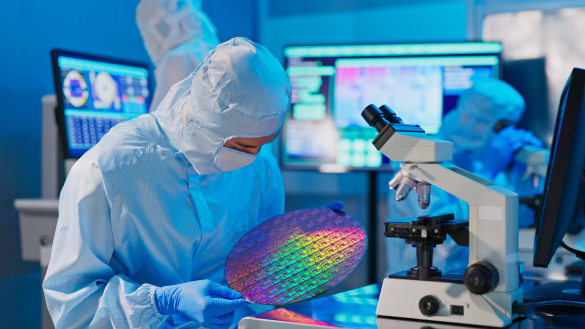 A technician with wafer doing testing