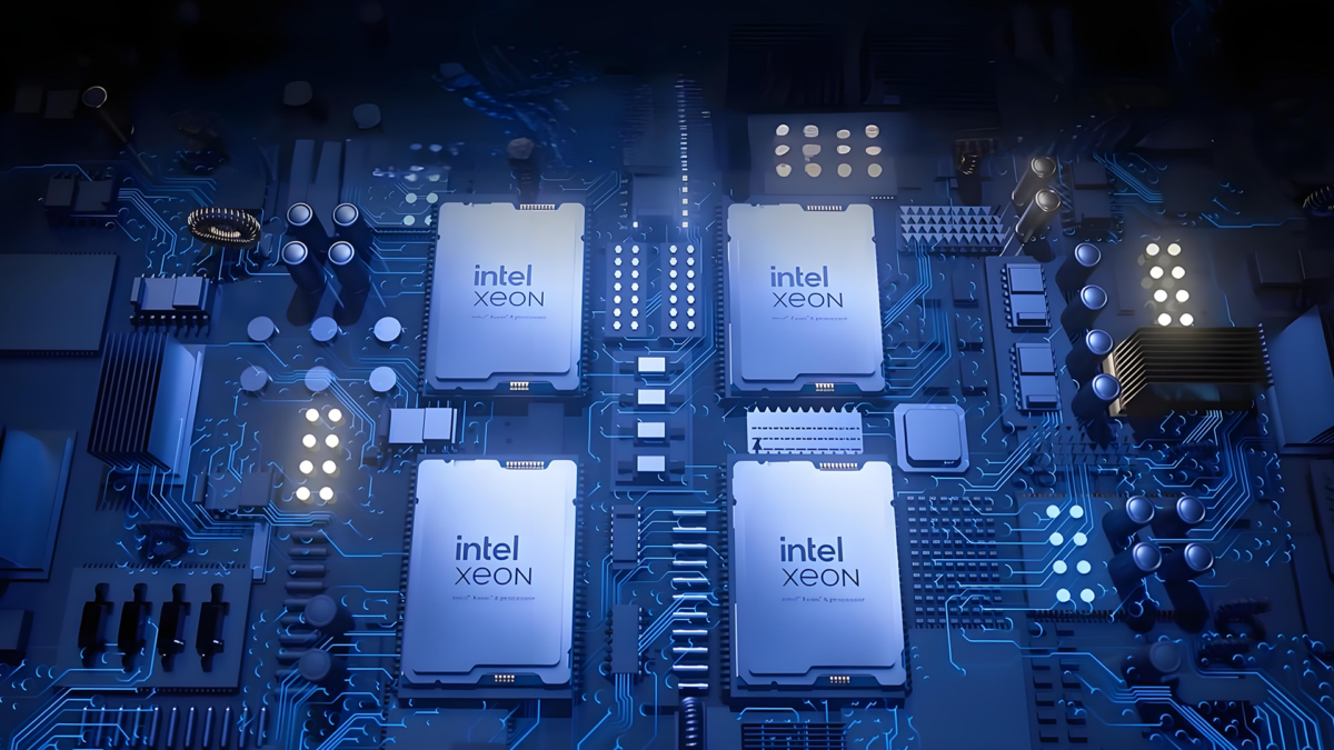 A close-up view of a circuit board featuring four Intel Xeon processors. The processors are evenly spaced and surrounded by various electronic components, with a blue lighting effect highlighting the intricate pathways and connections.